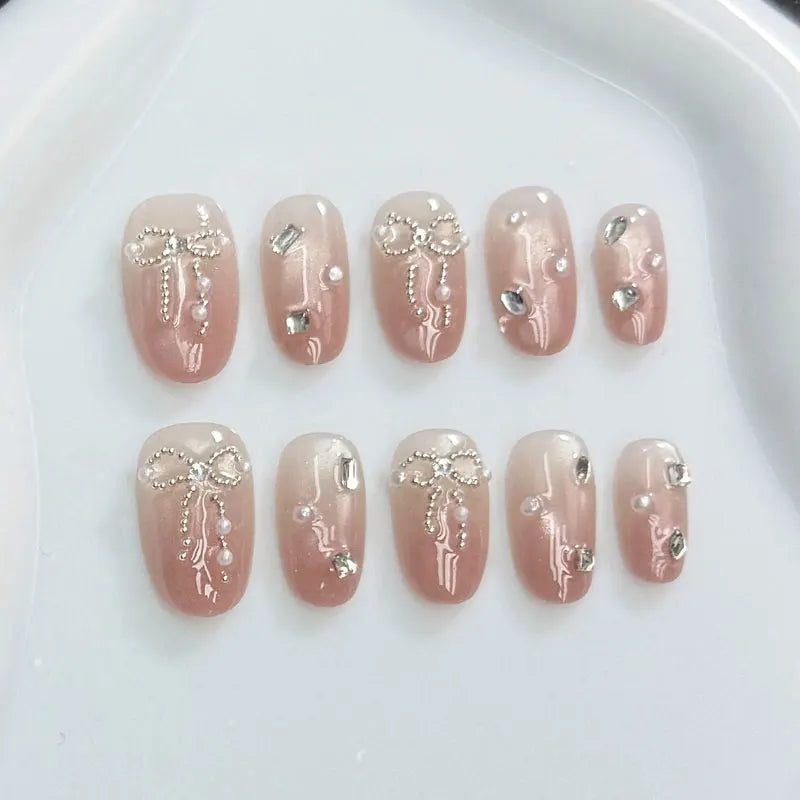 10Pcs Handmade Press on Nails with Butterfly and Rhinestone Accents Cat-Eye Design Nude and Pink Gradient Fair-Looking Manicure