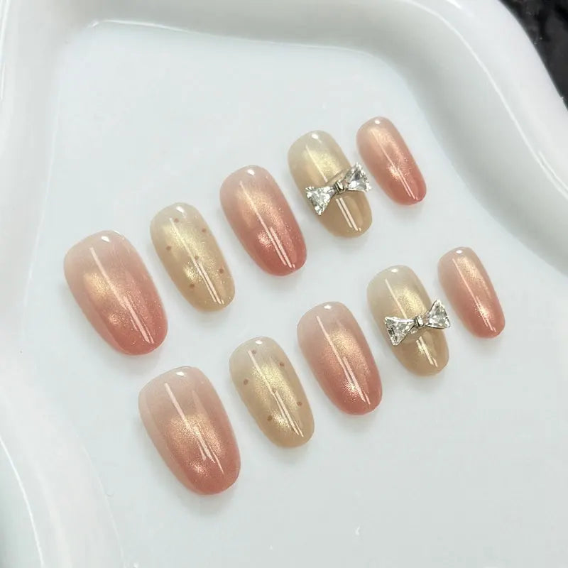 10Pcs Handmade Press on Nails with Butterfly and Rhinestone Accents Cat-Eye Design Nude and Pink Gradient Fair-Looking Manicure