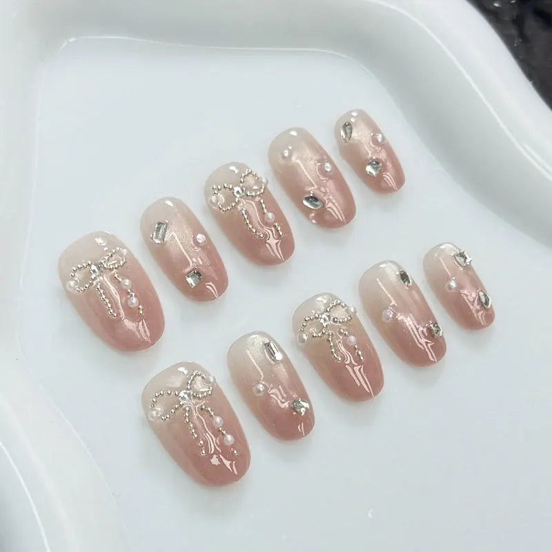 10Pcs Handmade Press on Nails with Butterfly and Rhinestone Accents Cat-Eye Design Nude and Pink Gradient Fair-Looking Manicure
